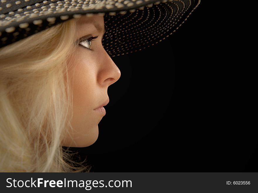 Beautiful Image of a woman in a hat On Black. Beautiful Image of a woman in a hat On Black