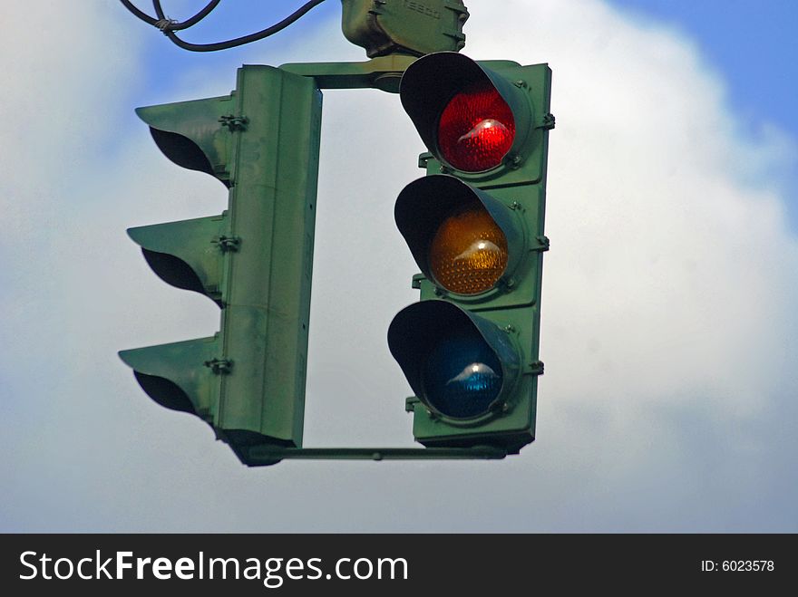 Traffic light gleaming red amonst the skyscape. Traffic light gleaming red amonst the skyscape.