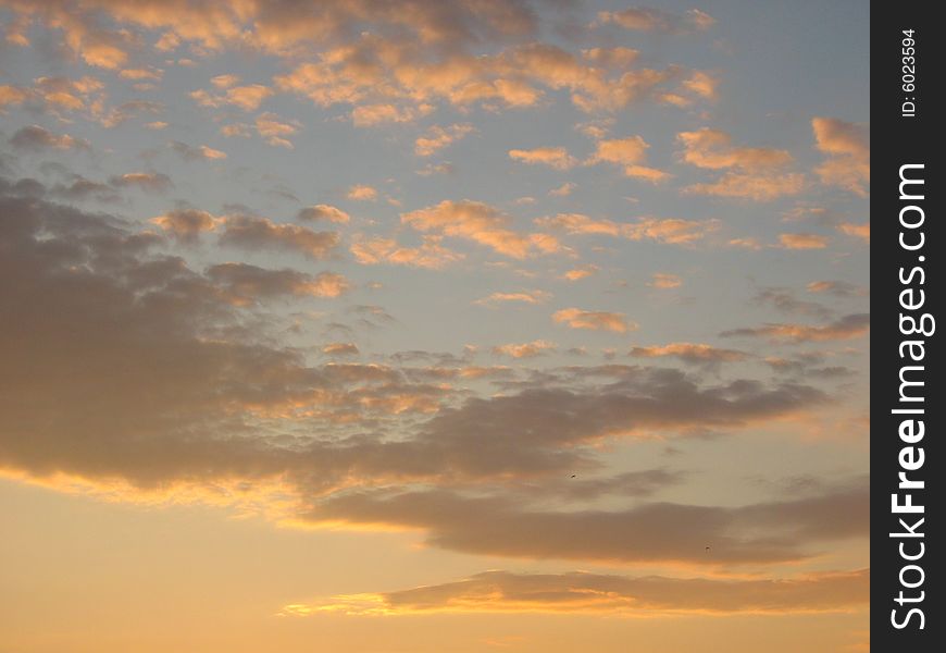 Sunrise above Kamchatcka.Gold clouds.