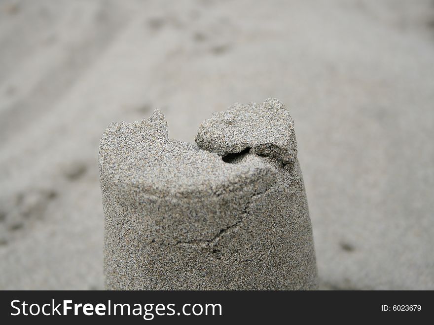 A crack in a sand pillar at the ocean.