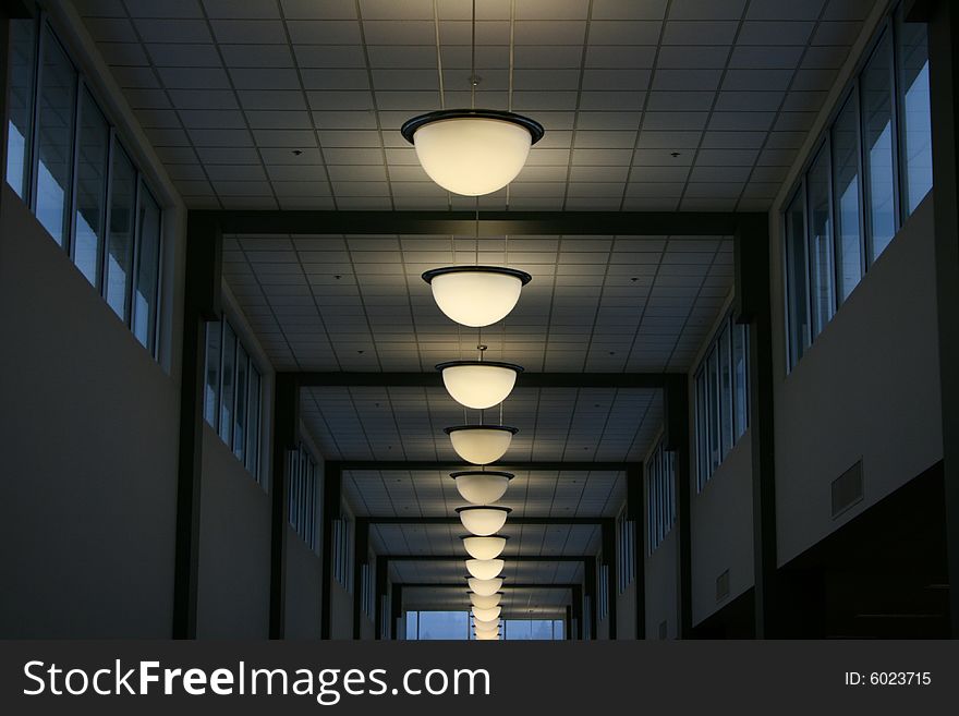 Lights in a line indoors in a conference center.
