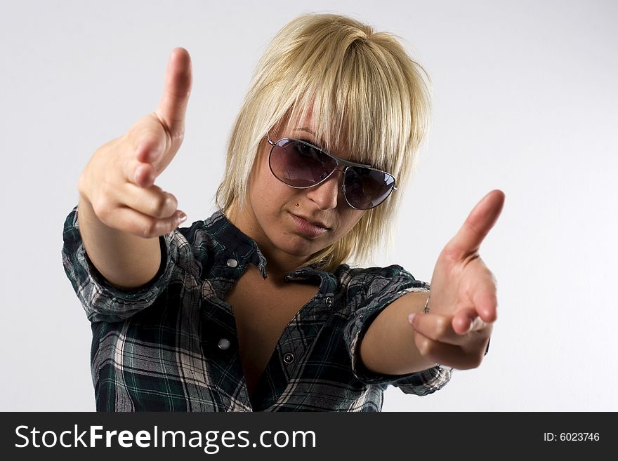 Young Stylish Girl Doing Fake Guns With Her Hands