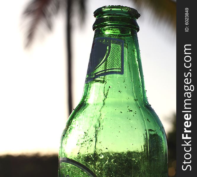 Green empty beer bottle closeup