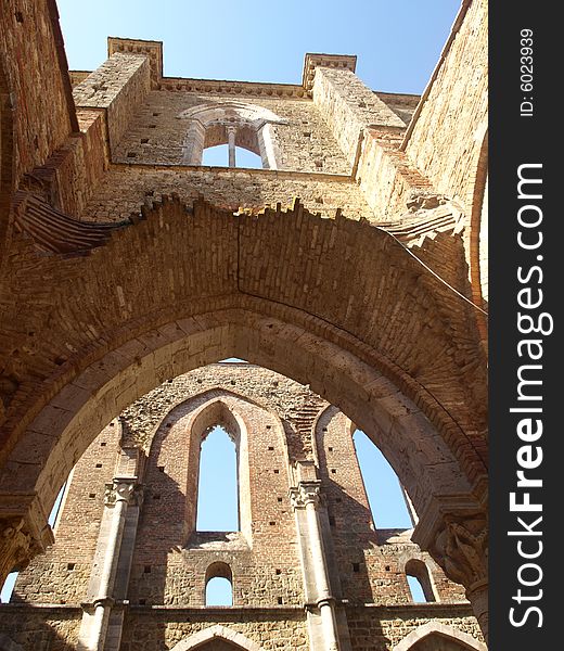 A beautiful shot of a glimpse of the aisles of San Galgano abbey. A beautiful shot of a glimpse of the aisles of San Galgano abbey.