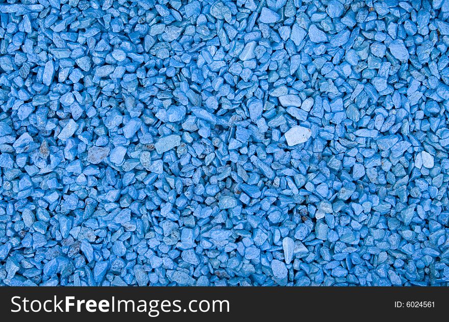 Blue small textured stones background. Blue small textured stones background