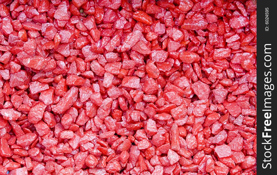 Red small textured stones background