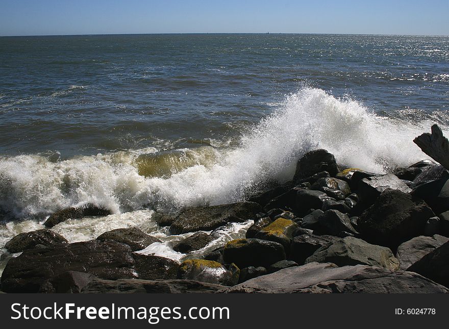 Ocean waves crashing in the rocks of the jetty near Ocean Shores Washington. Ocean waves crashing in the rocks of the jetty near Ocean Shores Washington.