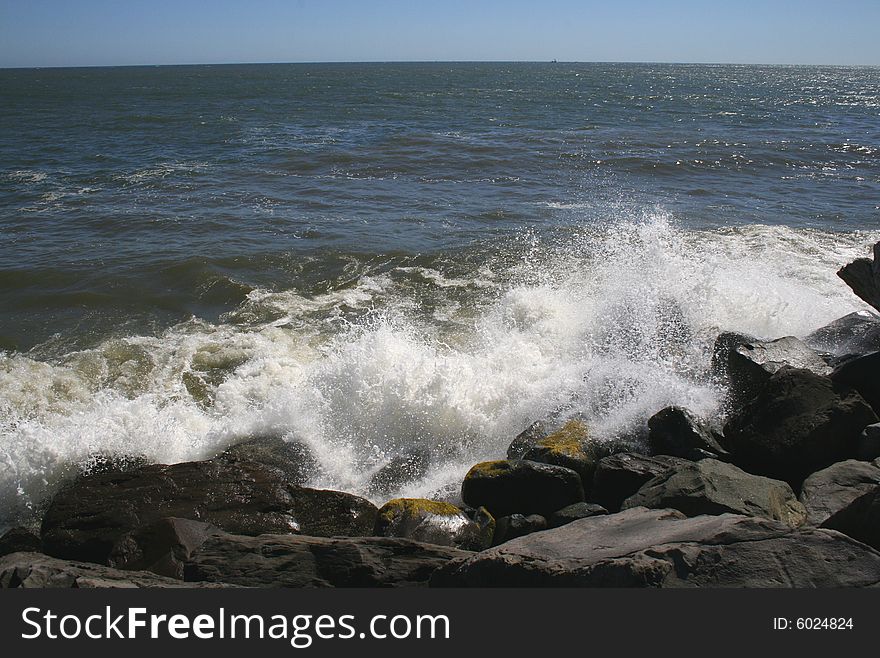 Ocean waves crashing in the rocks of the jetty near Ocean Shores Washington. Ocean waves crashing in the rocks of the jetty near Ocean Shores Washington.