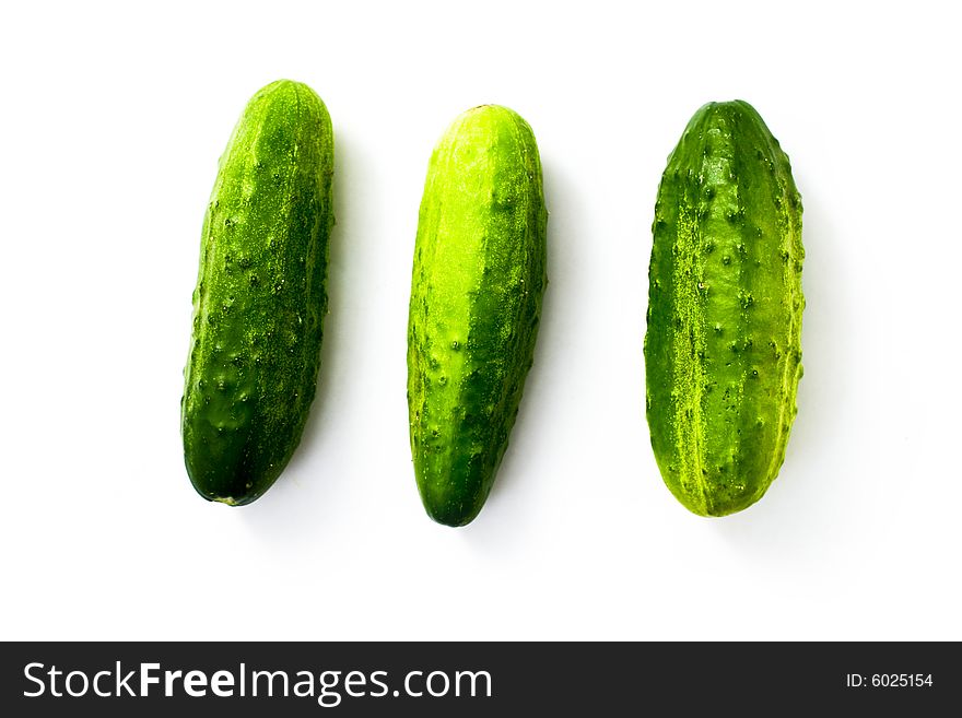 An image of three cucumbers on white background