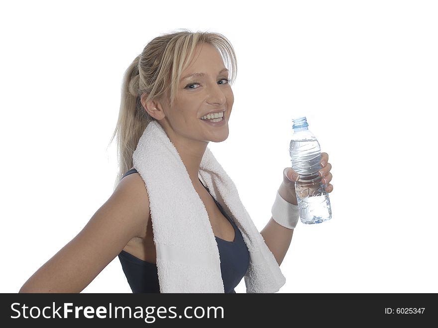 Young woman drinking water, wearing sporting outfit. Young woman drinking water, wearing sporting outfit