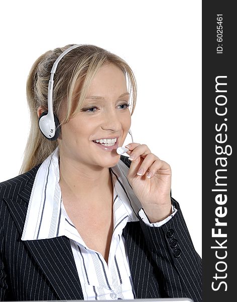 Young woman working in a callcenter. Headset in use.