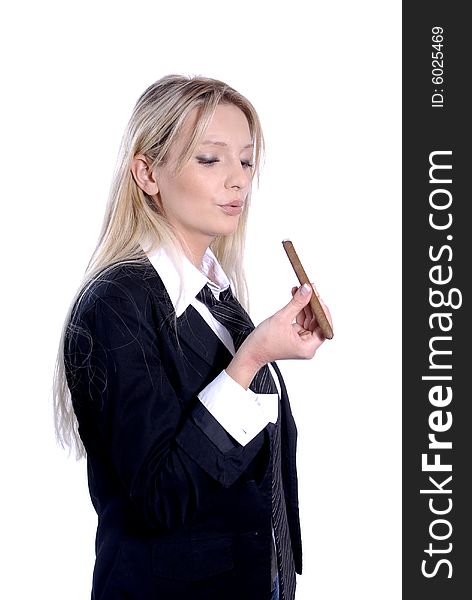 Young business woman is smoking a cigar