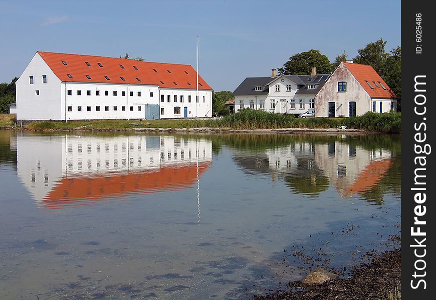 Mansion big farmhouse reflected in the sea Funen Denmark. Mansion big farmhouse reflected in the sea Funen Denmark