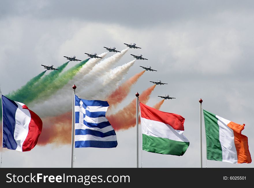 Planes with smoke, italian colours and flags on the front