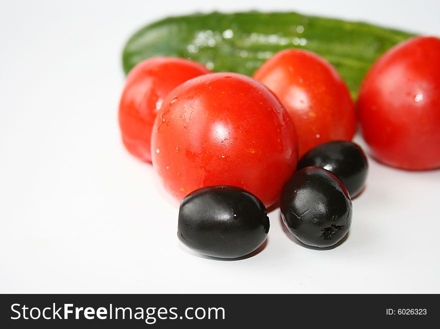 Ingredients, tomatoes, cucumbers and olives. Ingredients, tomatoes, cucumbers and olives