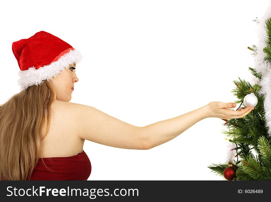 Mrs santa claus holding christmas ornament hanging on christmas tree. Mrs santa claus holding christmas ornament hanging on christmas tree