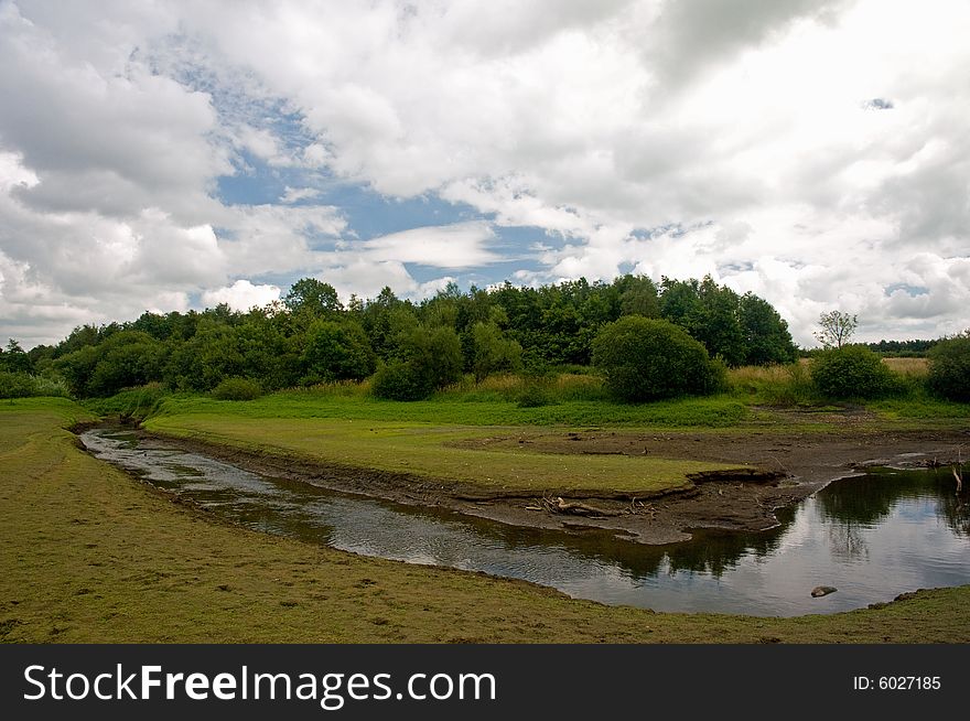 A little stream at the the reservoir at 
tittesworth near leek in the united kingdom. A little stream at the the reservoir at 
tittesworth near leek in the united kingdom