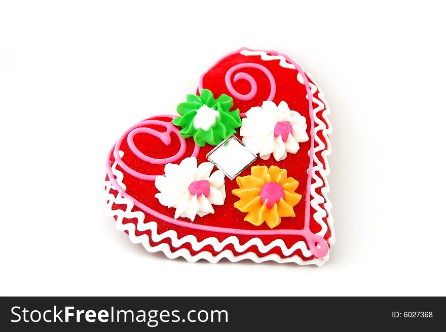 Heart shaped cookie, red and vivid colors, isolated on white