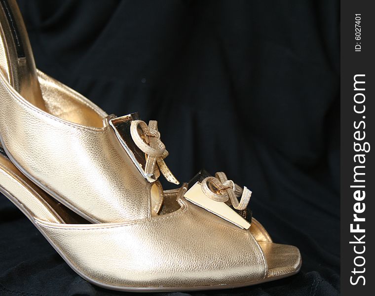 Woman golden shoes