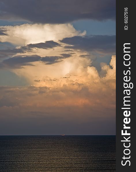 Distant freighter against a spectacular sky over the Black Sea. Distant freighter against a spectacular sky over the Black Sea