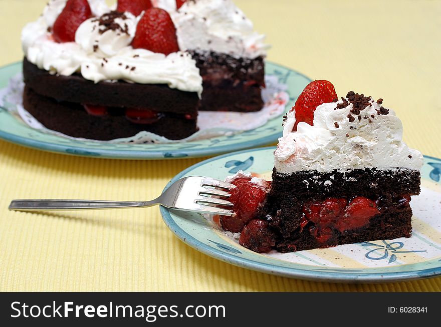 Delicious Chocolate Strawberry Mousse cake with a slice in front. Delicious Chocolate Strawberry Mousse cake with a slice in front.