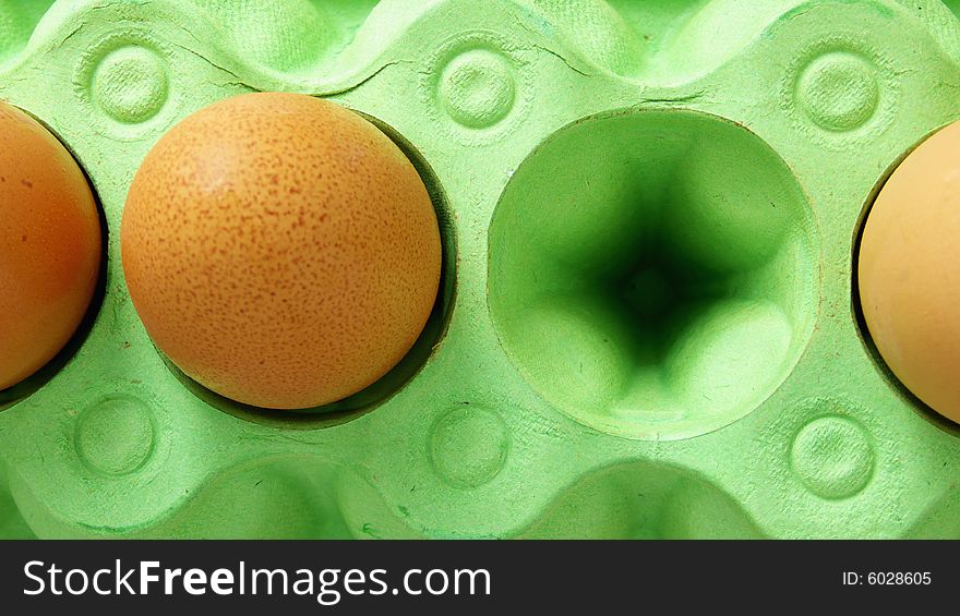 Brown Eggs in a green Box