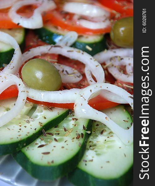 Fresh salad with olives and onion