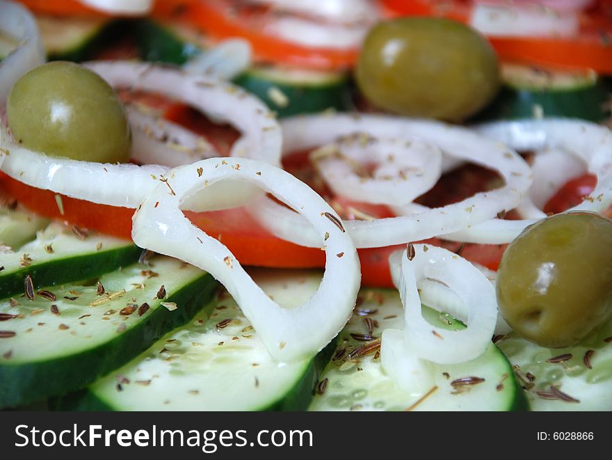 Fresh salad with olives onion and cucumber