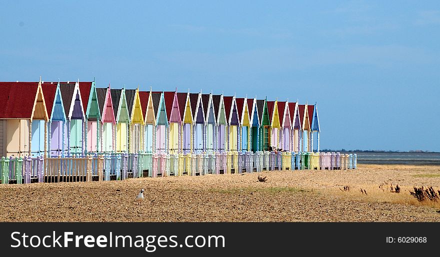 Shot of the beach and some colourful huts. Shot of the beach and some colourful huts