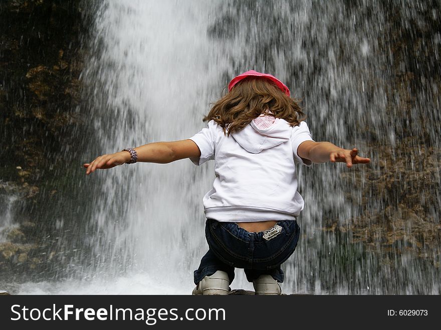 Girl posing at the falls. Girl posing at the falls