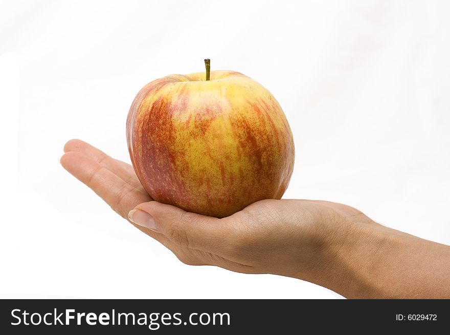 Apple on the hand, white background