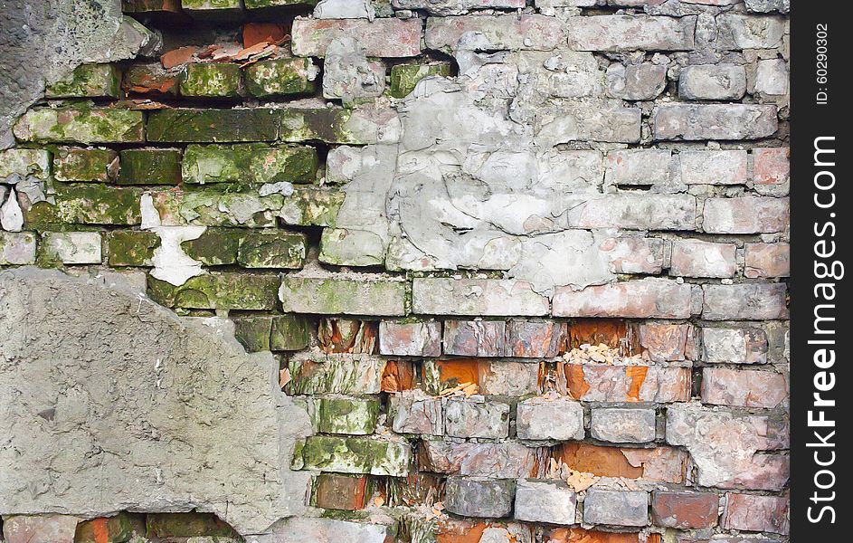 Old crumbling brick wall outside. Old crumbling brick wall outside