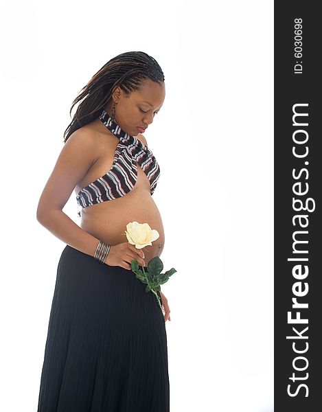 Beautiful Young African American Pregnant Woman Holding a Yellow Rose. Beautiful Young African American Pregnant Woman Holding a Yellow Rose