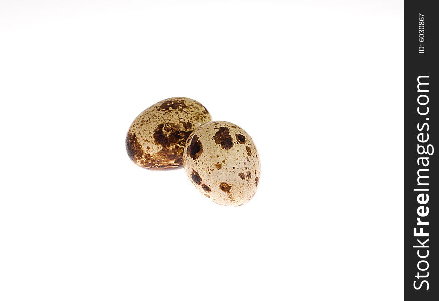Quails' eggs on the white background