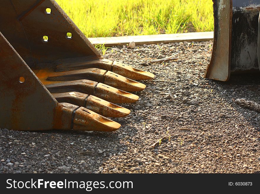 Lifting bucket on ground with 5 arms. Lifting bucket on ground with 5 arms