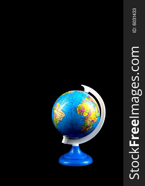School globe isolated on a black background