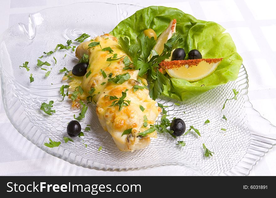 Fish decoratet with salad on plate. Fish decoratet with salad on plate