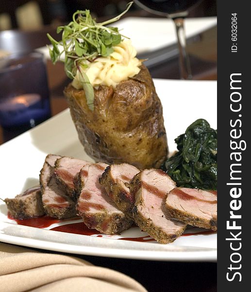 Sliced pork loin with spinach and double-baked potato