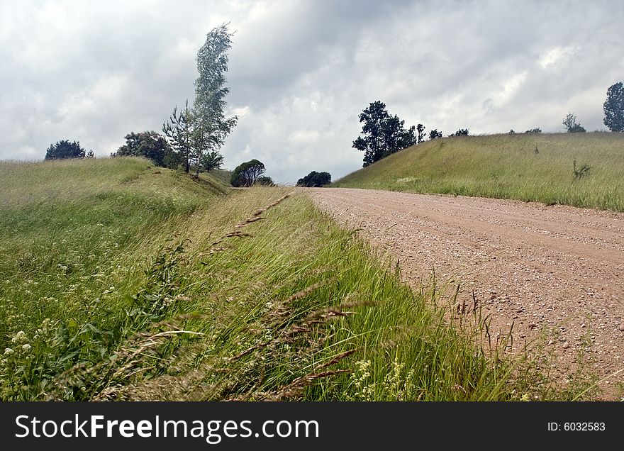 Rural landscape, cloudy weather, seaside of Latvia, road