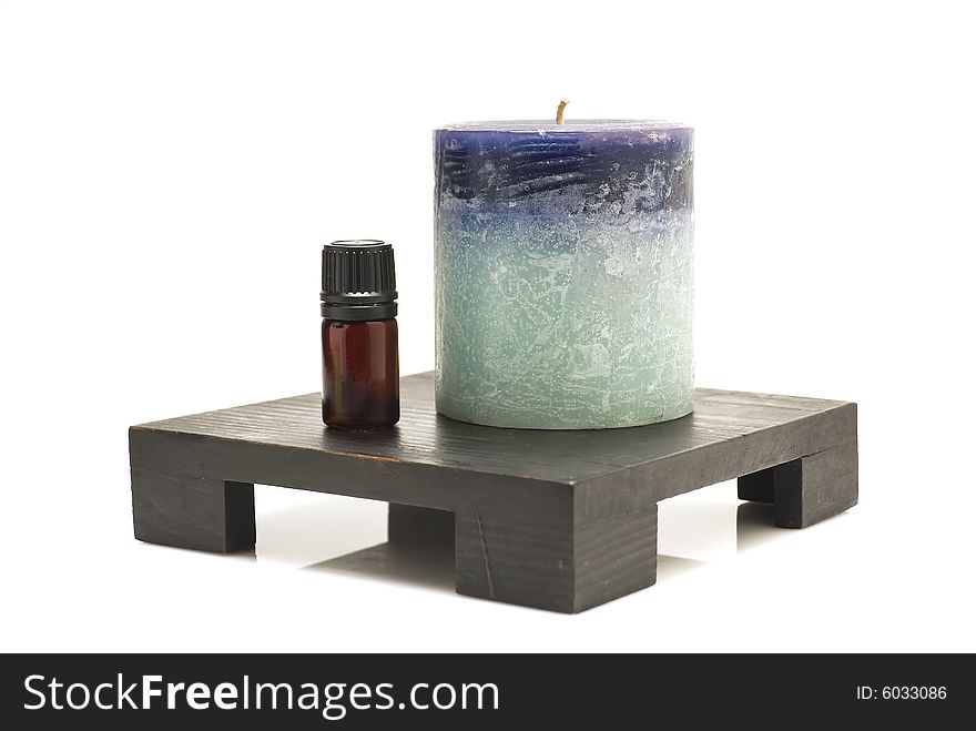 Still life of mineral oil and candle on top of candlestand. Still life of mineral oil and candle on top of candlestand