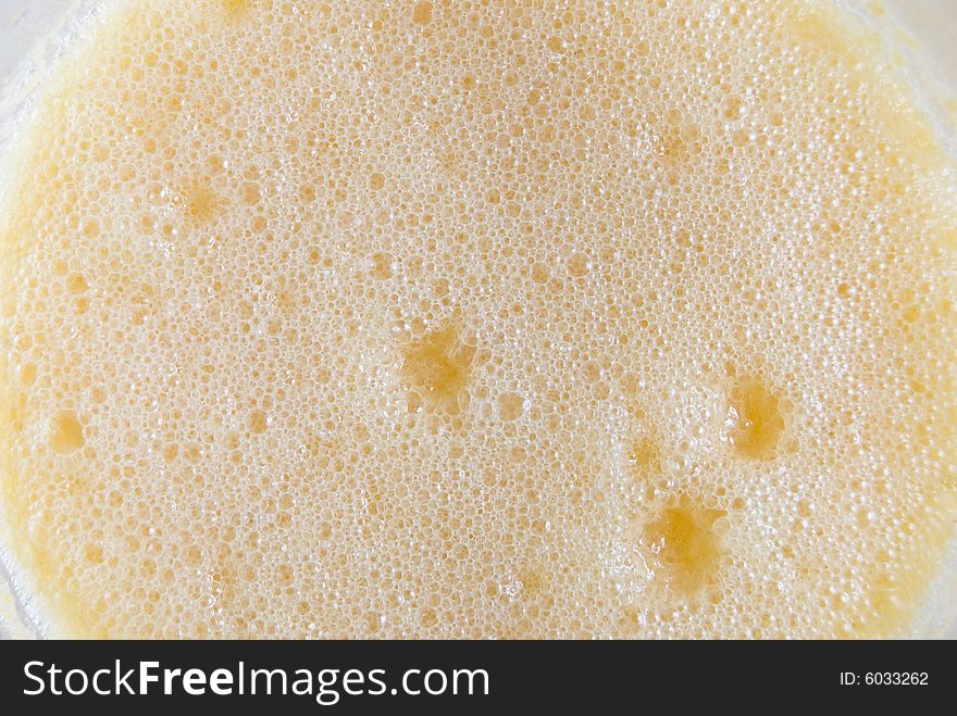 Closeup of froth of orange juice. Closeup of froth of orange juice