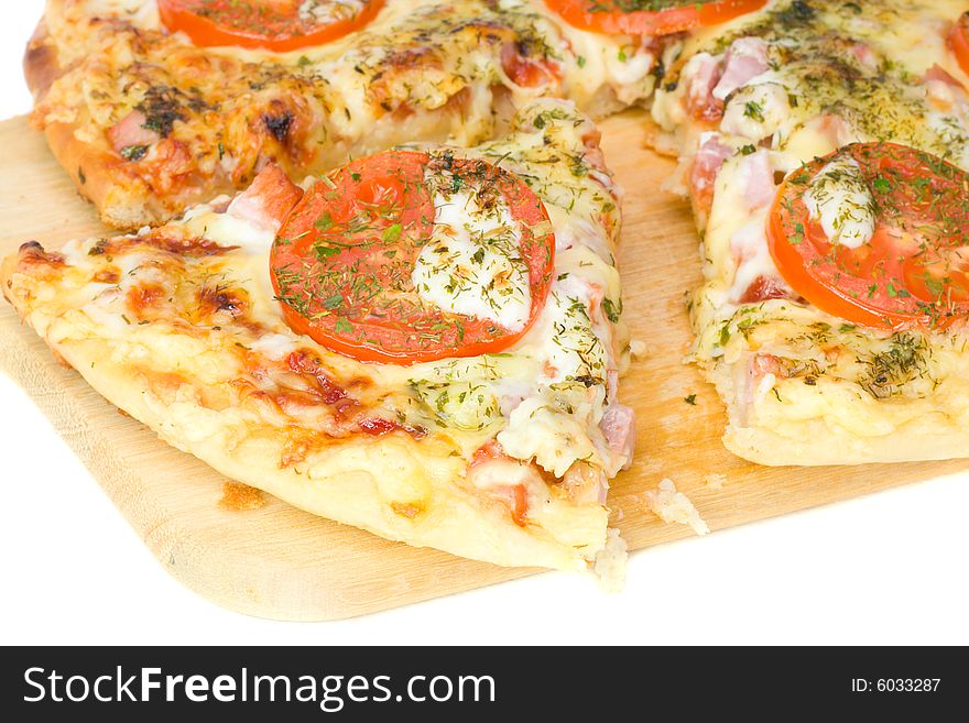 Close-up piece of pizza on board, isolated on white