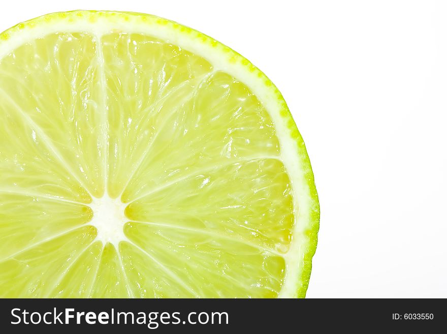 Fresh slice of lime isolated on white. Fresh slice of lime isolated on white