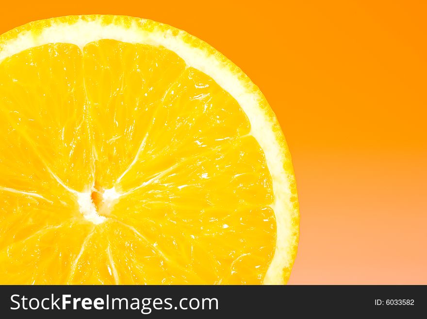 Fresh slice of orange with zesty gradient lighting. Fresh slice of orange with zesty gradient lighting
