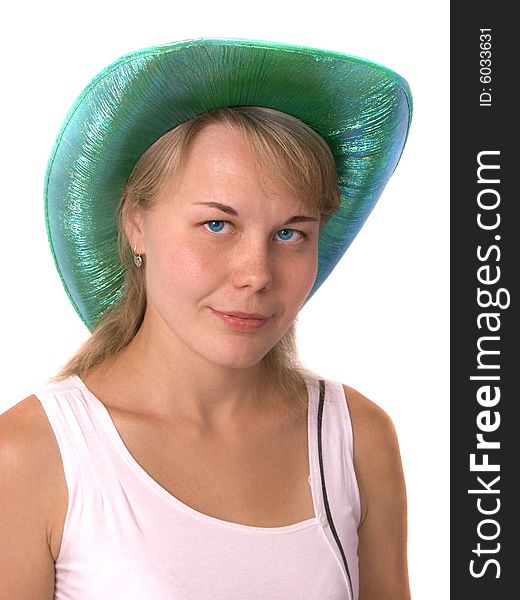The beautiful girl in a green cowboy's hat. Isolated