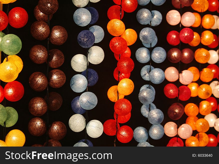 Many colorful balls in differently colors taken at night