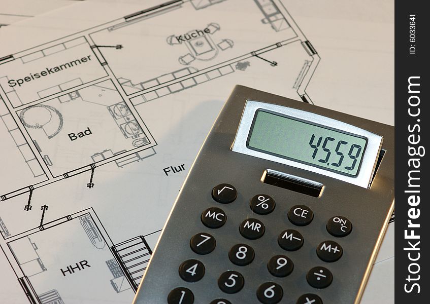 Calculator And A House Plan