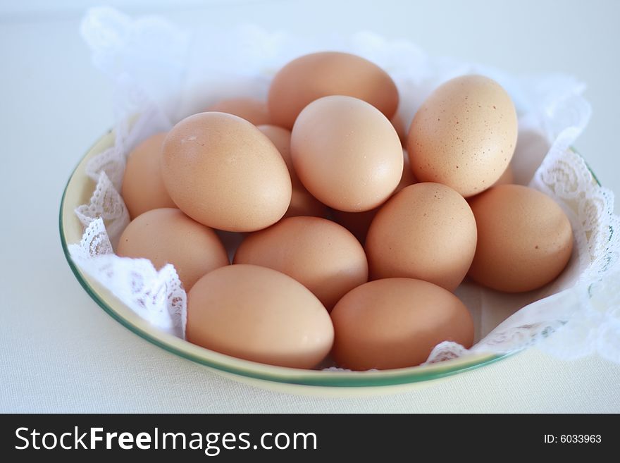 A closeup view of a bowl of fresh farm eggs. A closeup view of a bowl of fresh farm eggs.