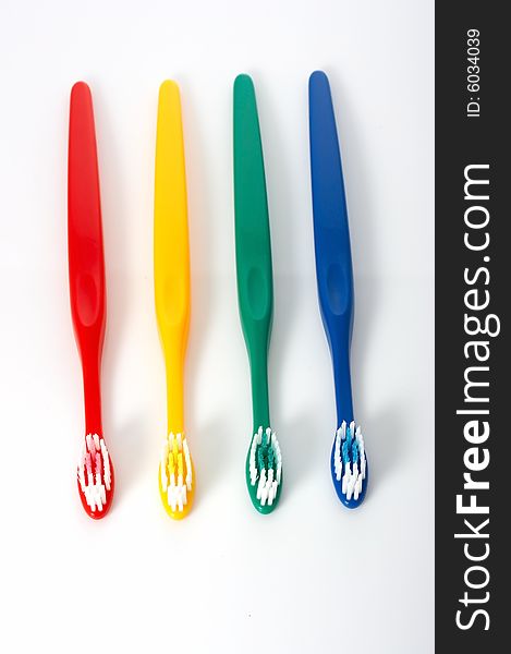 Row of four different color toothbrush - hygiene