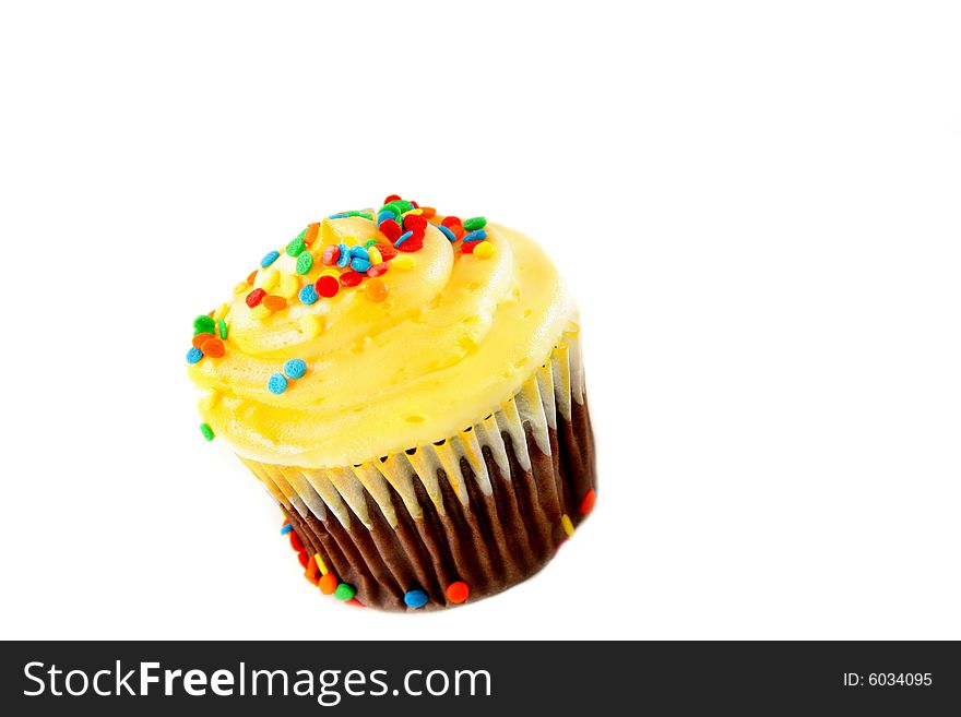 A single cupcake isolated on a white background with copyspace. A single cupcake isolated on a white background with copyspace.